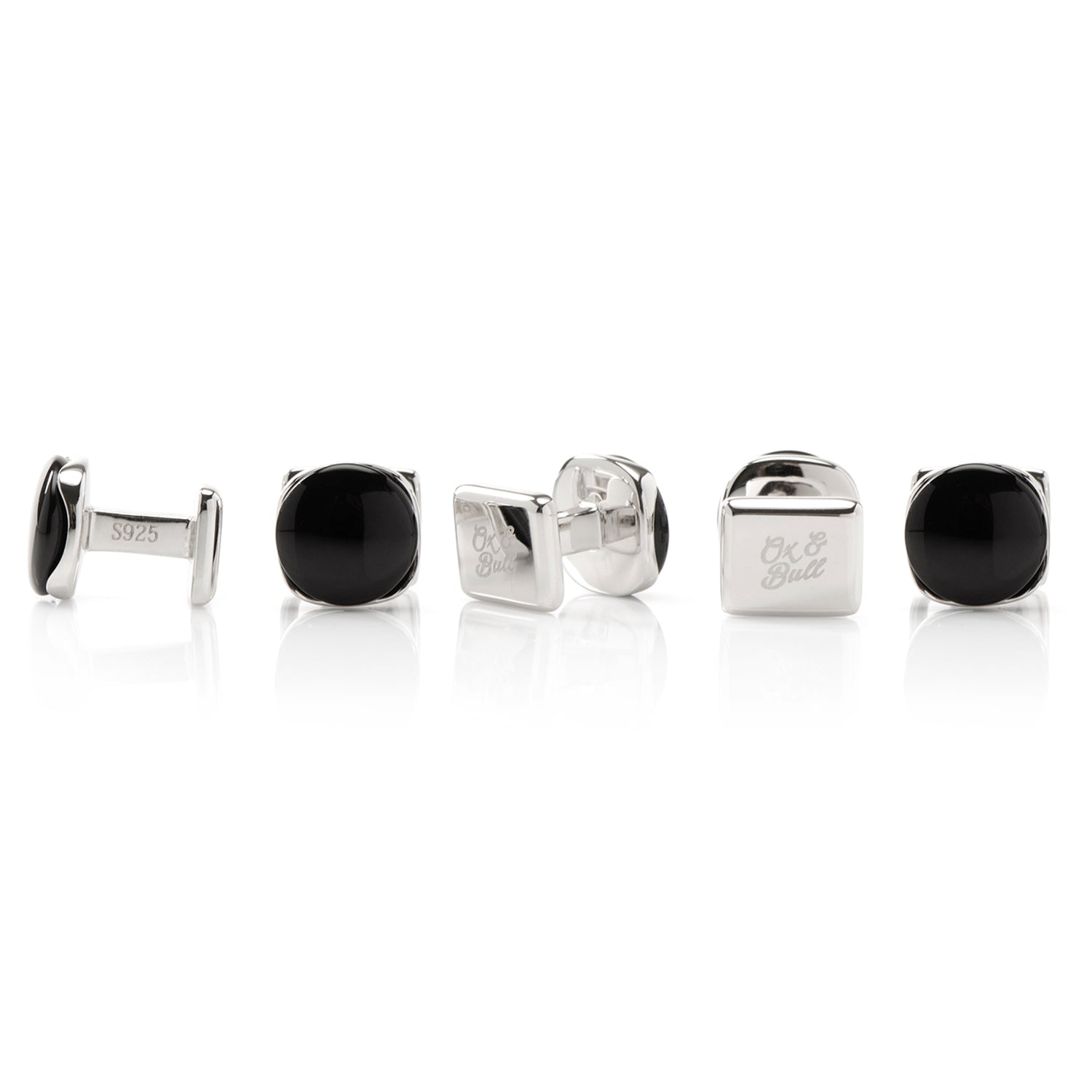 Set of silver and black cufflinks on a white background
