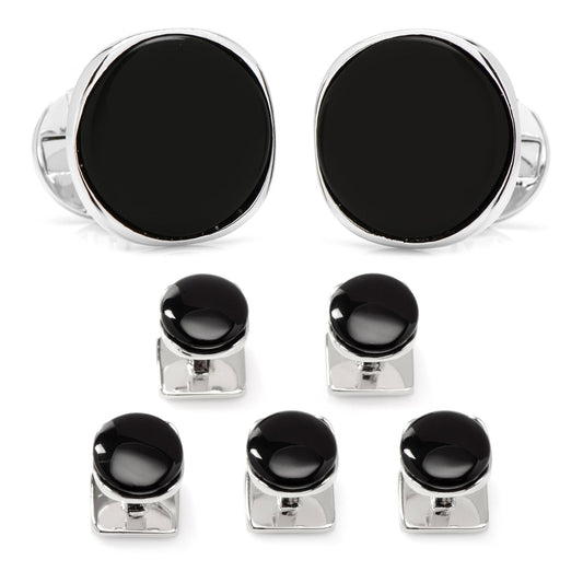 Set of black and silver cufflinks on a white background