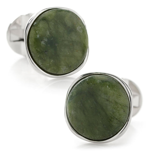 Green stone cufflinks with silver borders on a white background