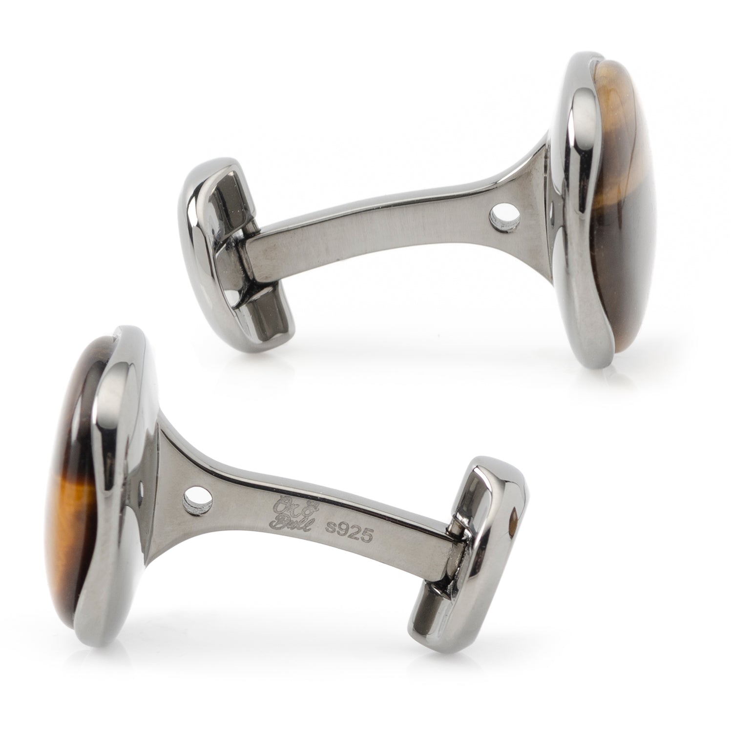 Pair of silver cufflinks with tortoiseshell accents on a white background