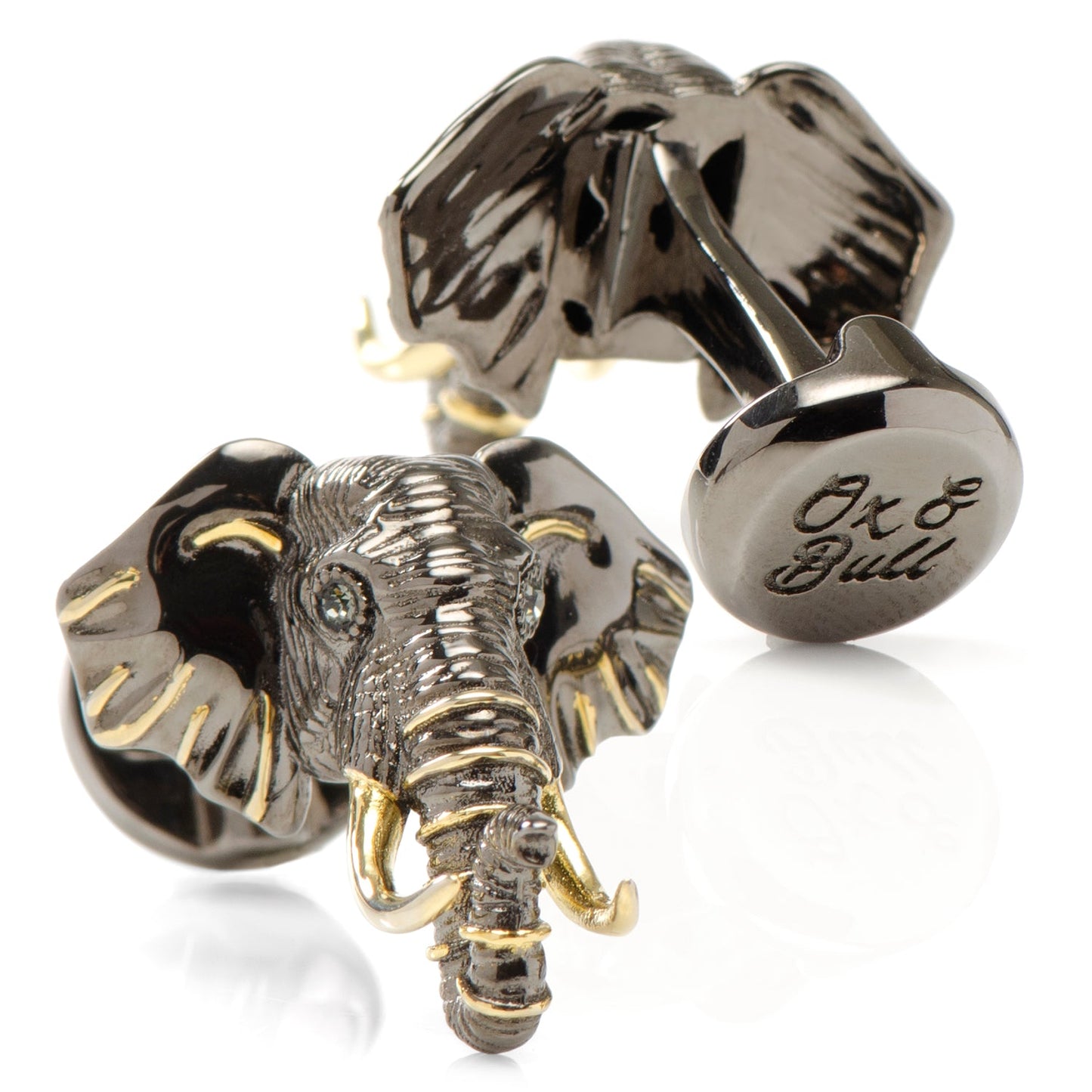 Silver elephant cufflinks with gold accents on a white background
