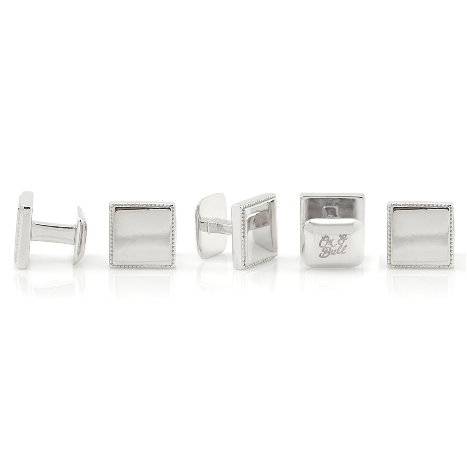 Set of silver cufflinks on a white background