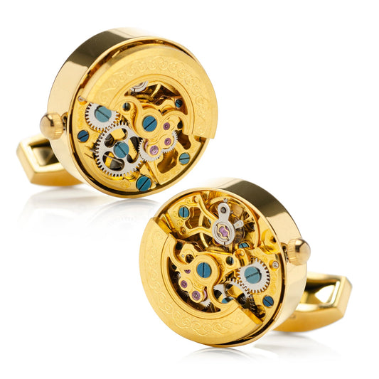 Gold cufflinks with mechanical design on a white background