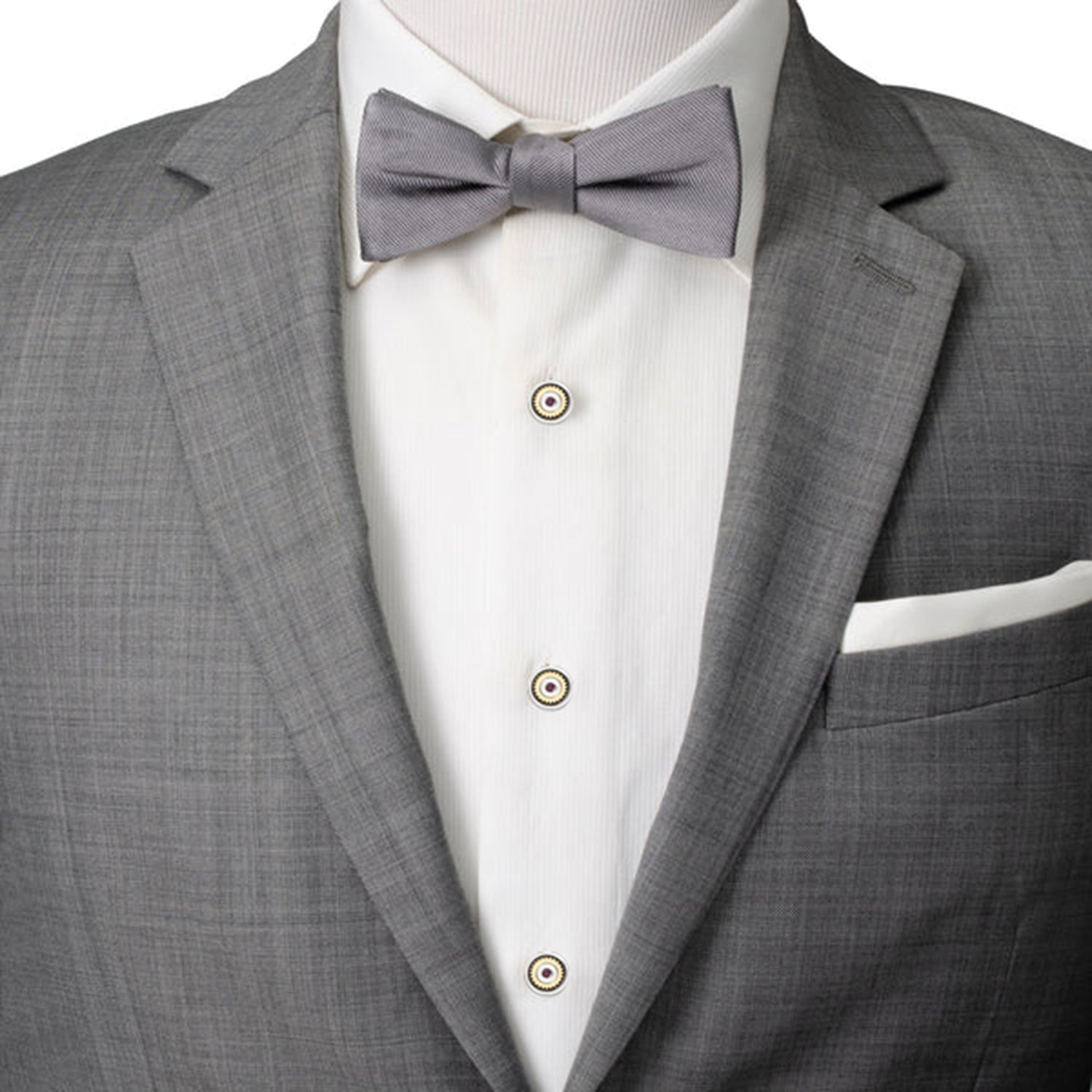 Gray suit jacket with a white shirt and gray bow tie on a mannequin.