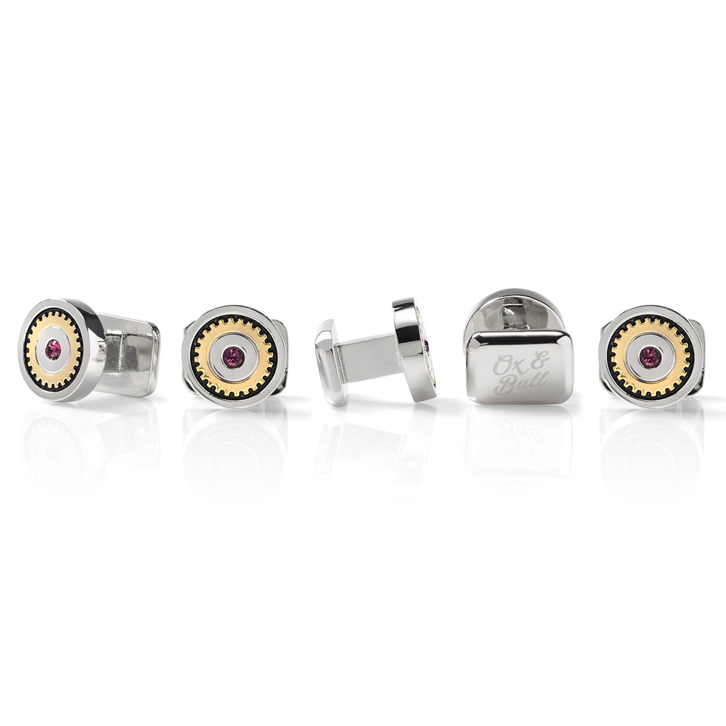 Set of silver cufflinks with gemstone accents on a white background