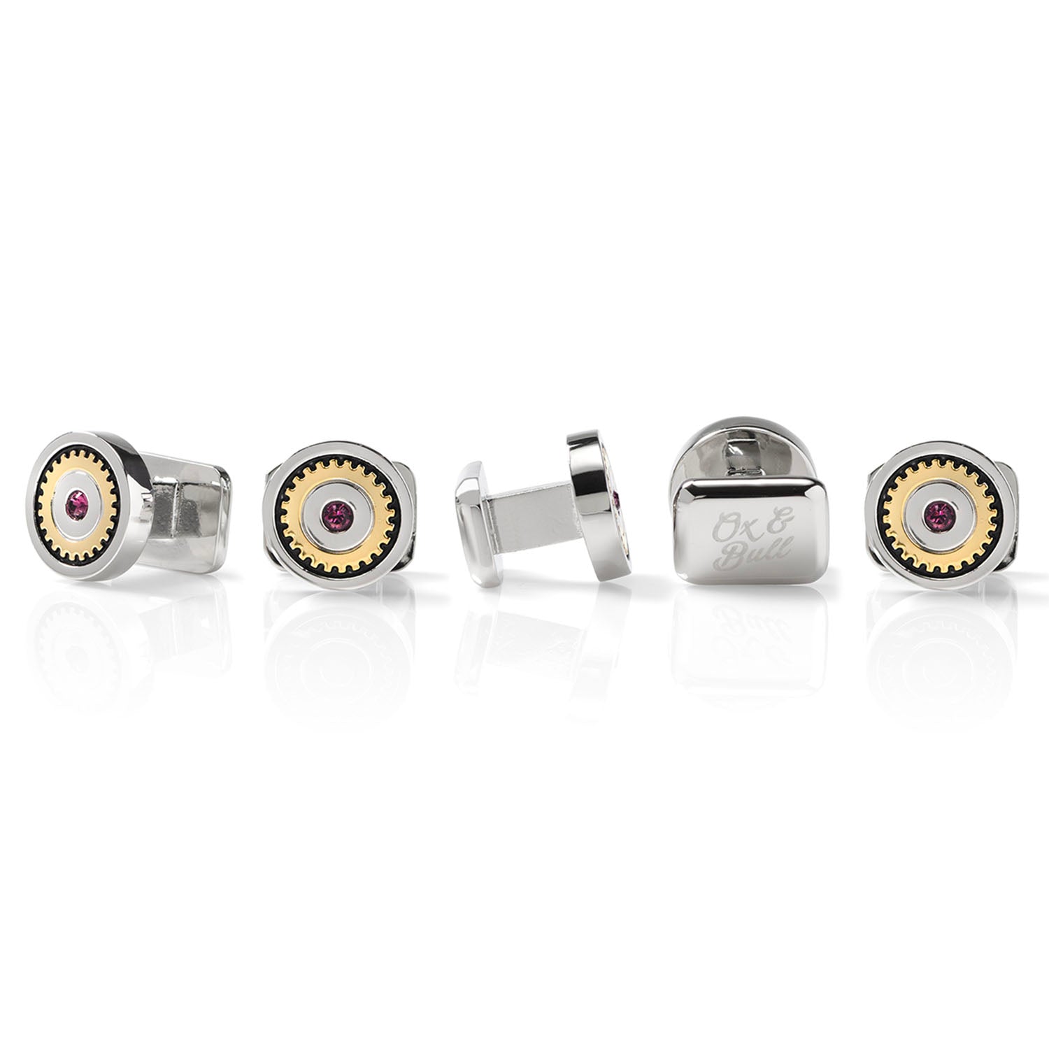Set of silver cufflinks with gemstone accents on a white background