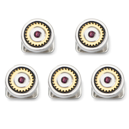 Five silver and gold rings with gemstones on a white background