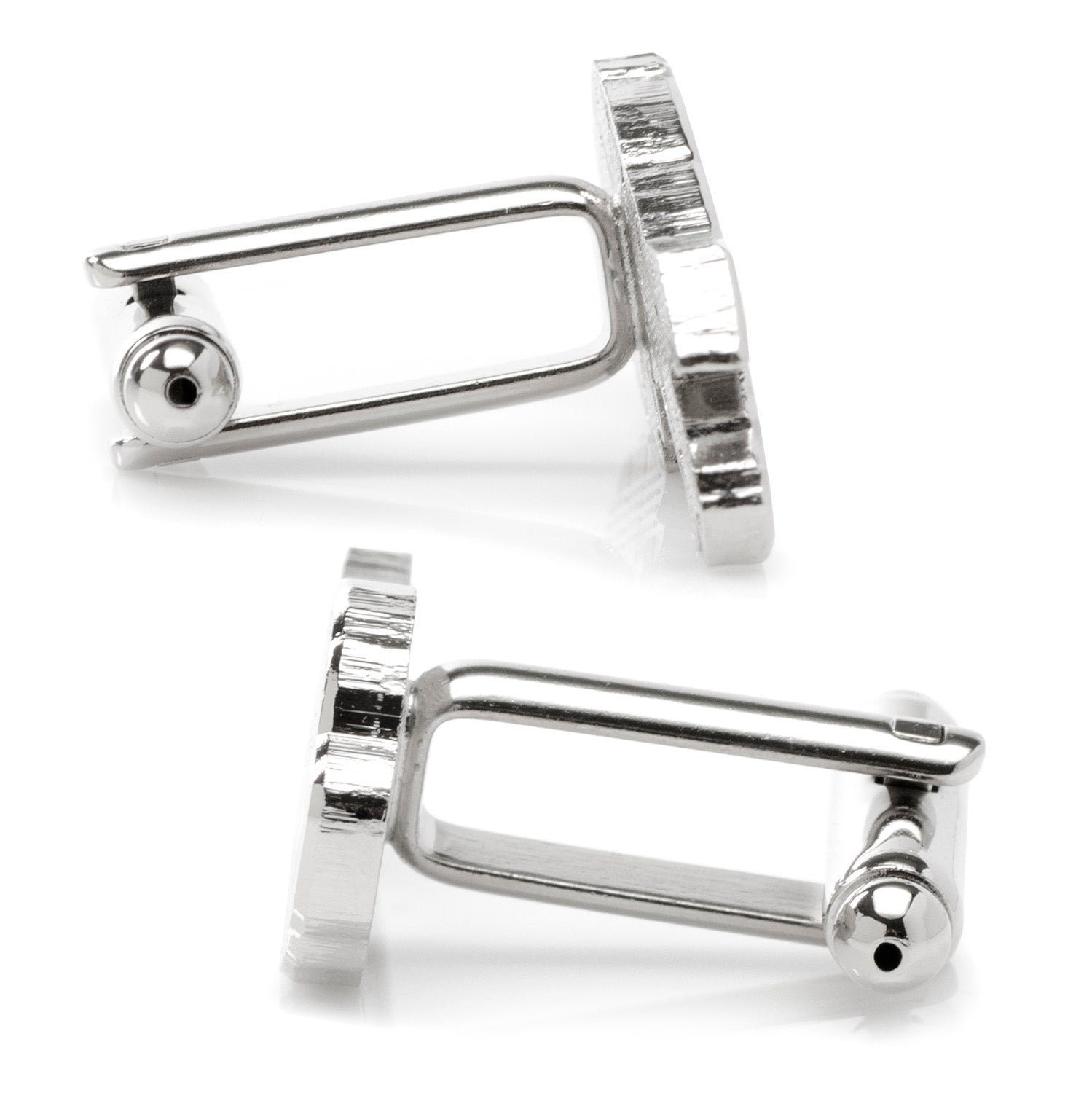 Pair of silver cufflinks on a white background