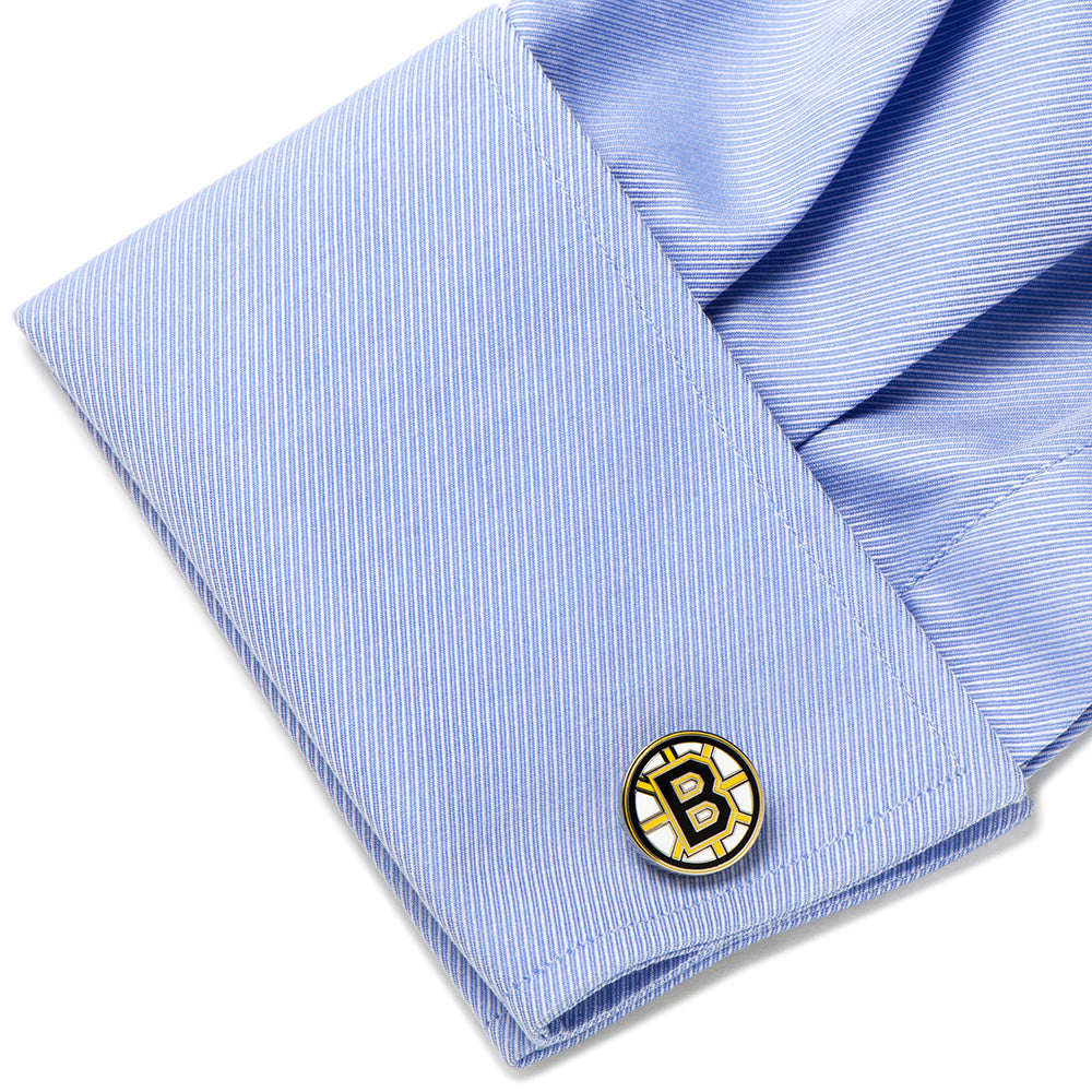 NHL Boston Bruins Cufflink with a logo on a light blue striped shirt