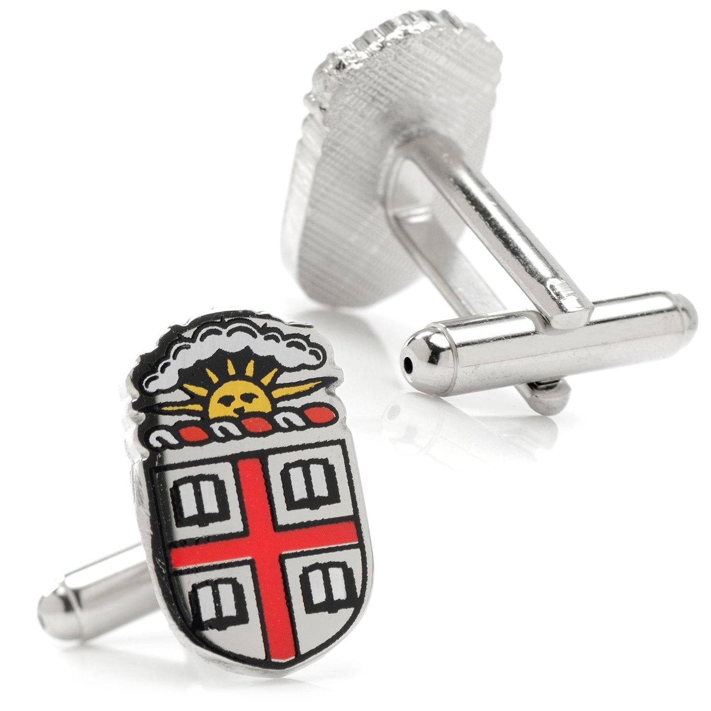 Silver cufflinks with a detailed emblem design on a white background
