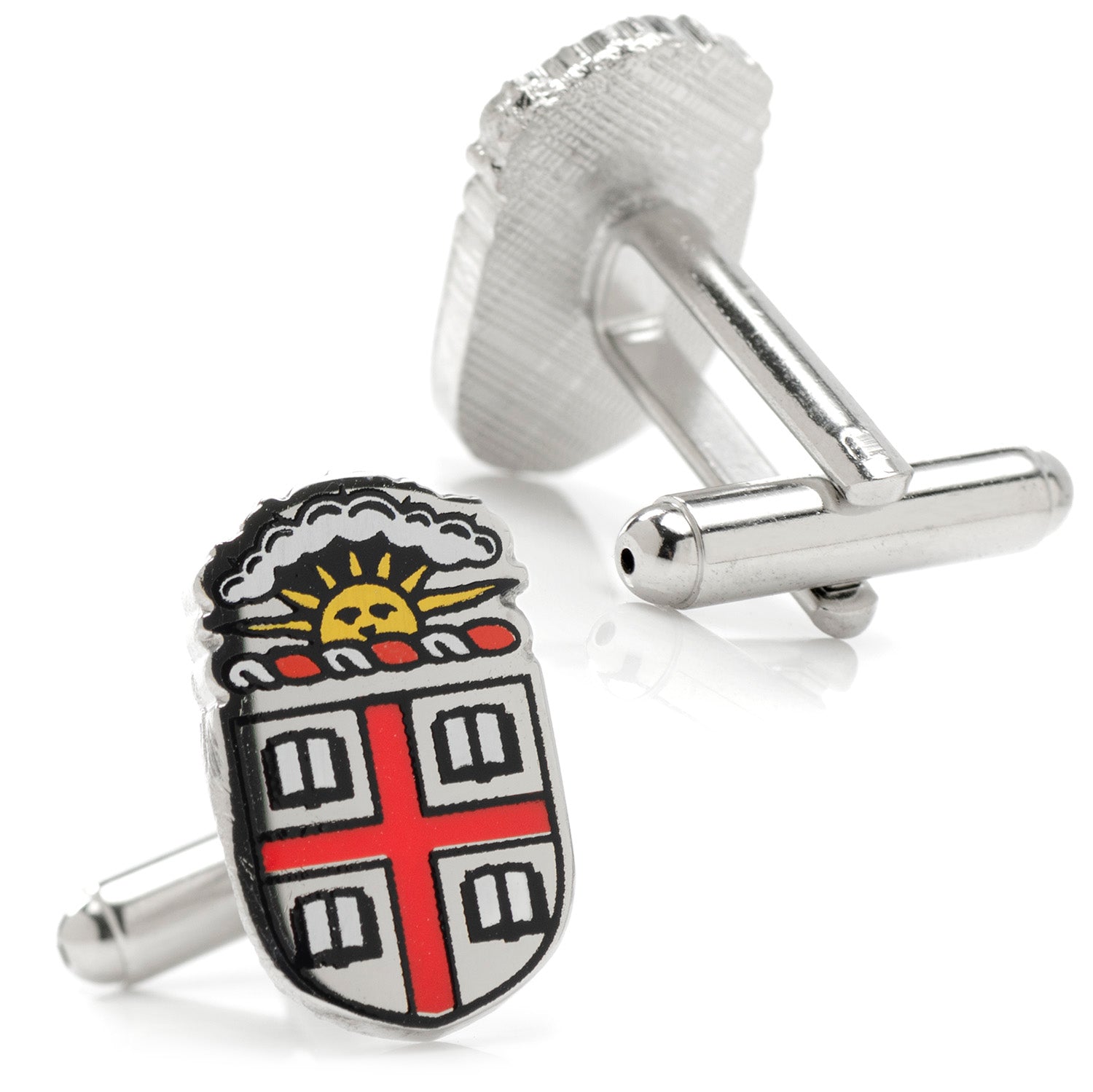 Silver cufflinks with a detailed emblem design on a white background