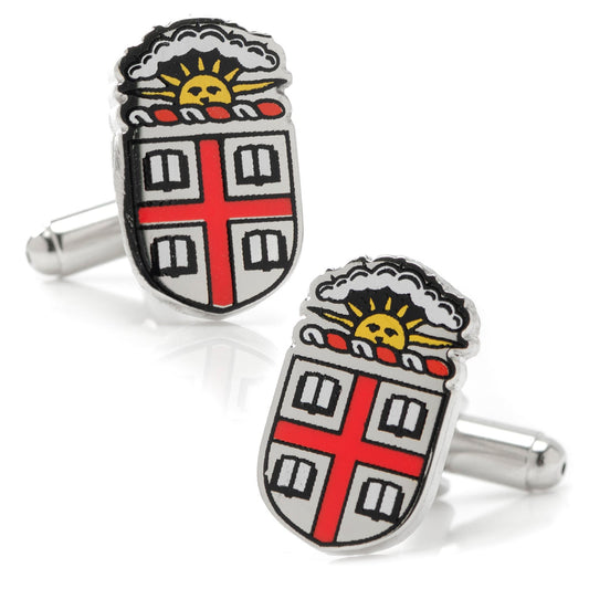 Pair of cufflinks with a shield design featuring a red cross and sun emblem on a white background.