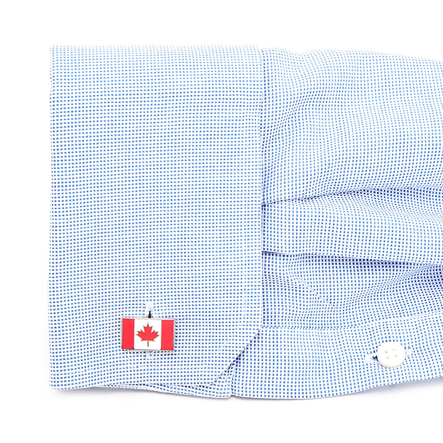 Blue checkered shirt with a Canadian flag patch on a white background