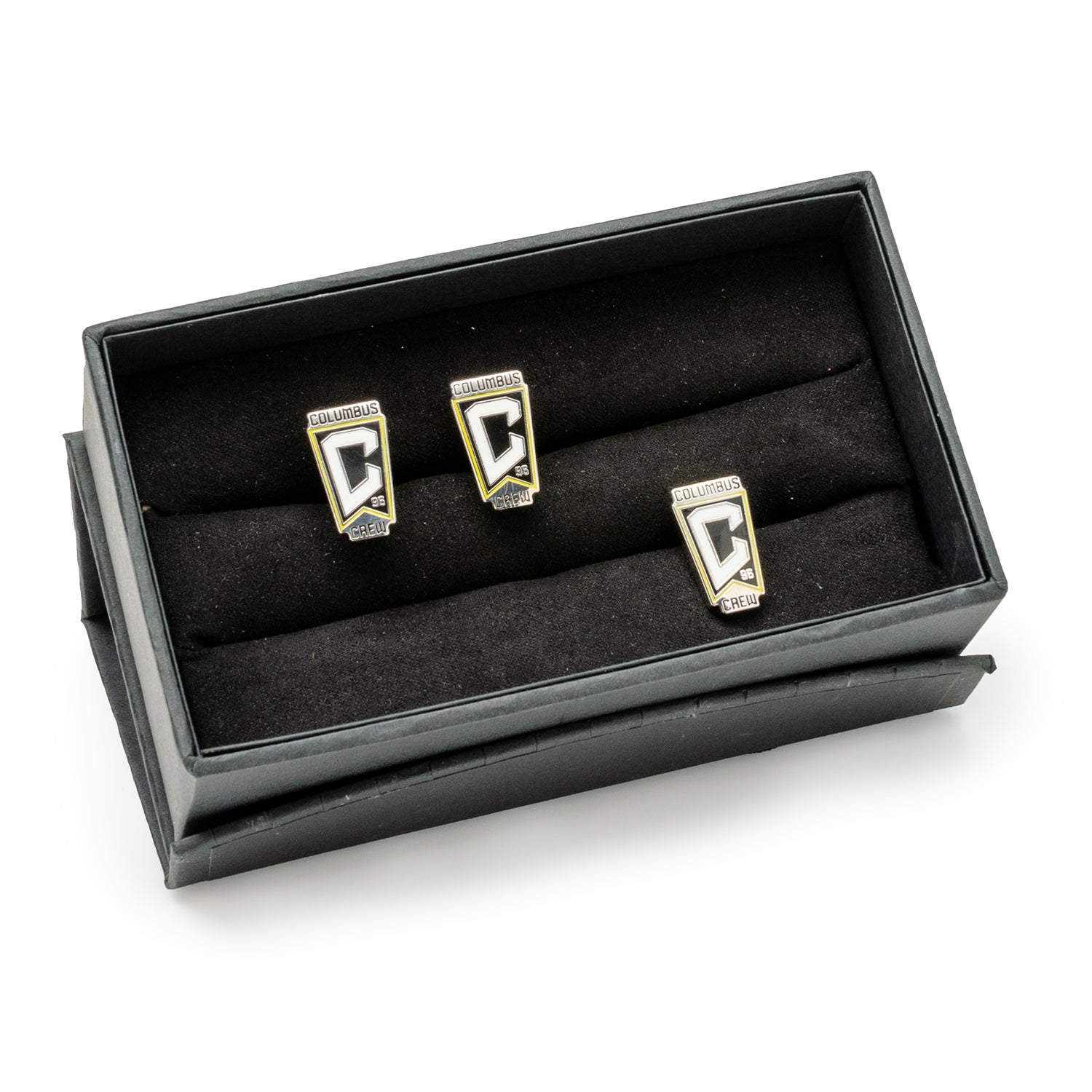 Three cufflinks in a black display box on a white background