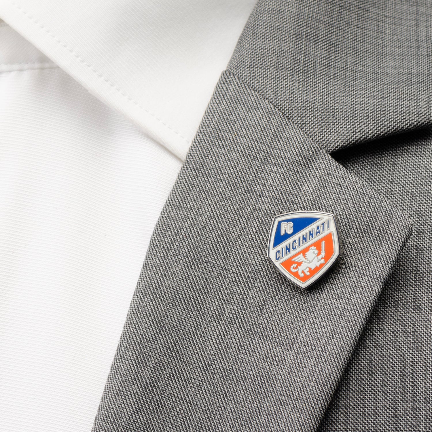 Pin on a gray blazer with a white shirt