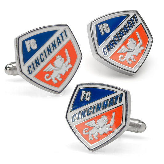 Three FC Cincinnati cufflinks on a white background