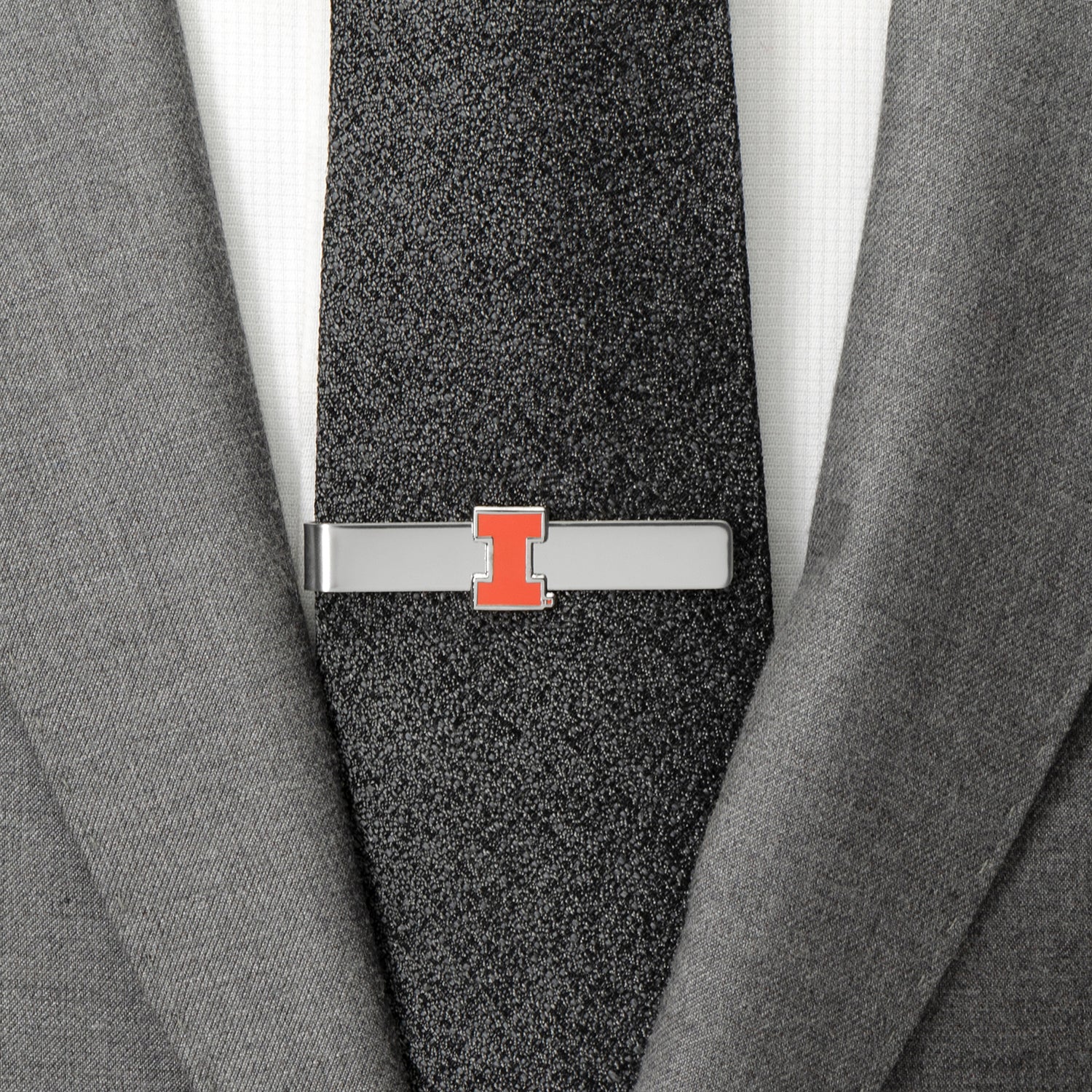 Tie clip with a logo on a gray suit and tie NCAA University of Illinois Cufflinks and Tie Bar Gift Set