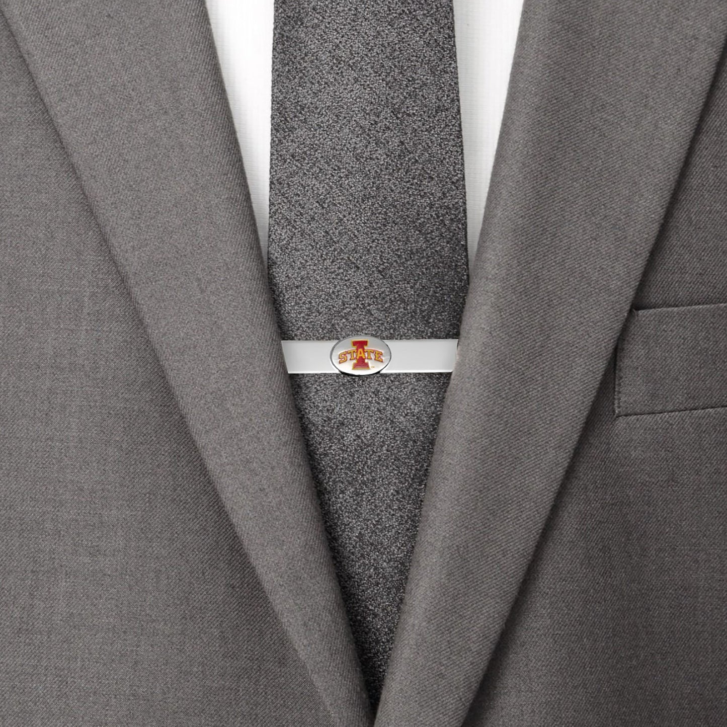 Gray suit jacket with a gray tie and silver tie clip on a white background