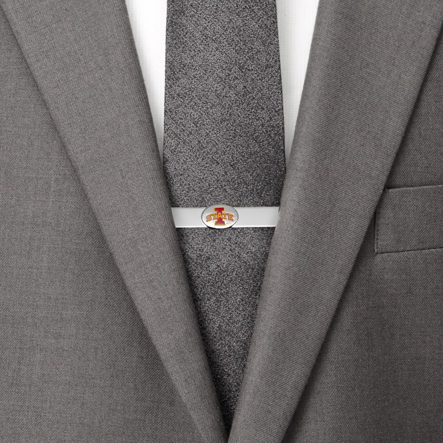 Gray suit jacket with a gray tie and silver tie clip on a white background