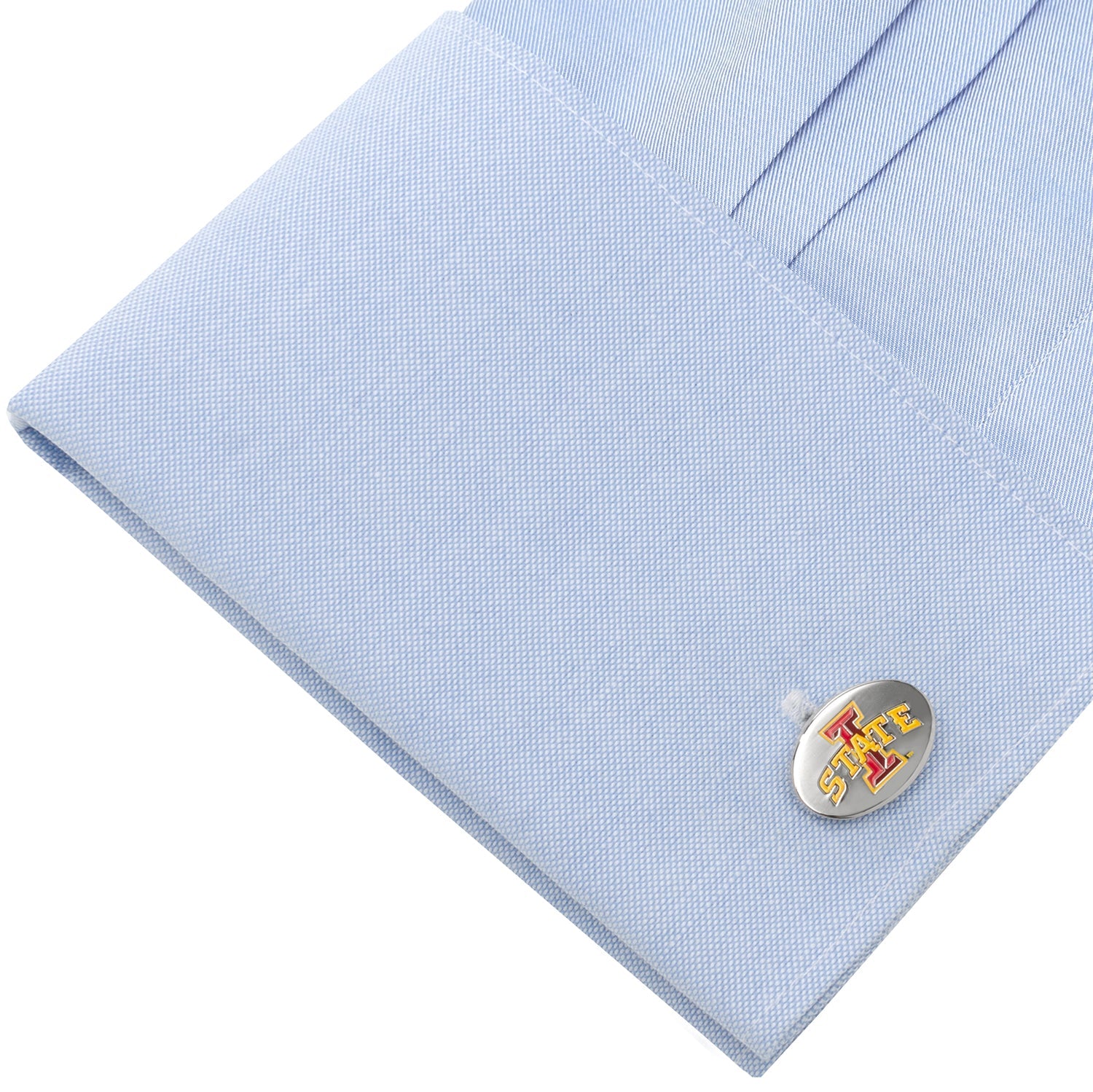 Cufflink on a light blue shirt
