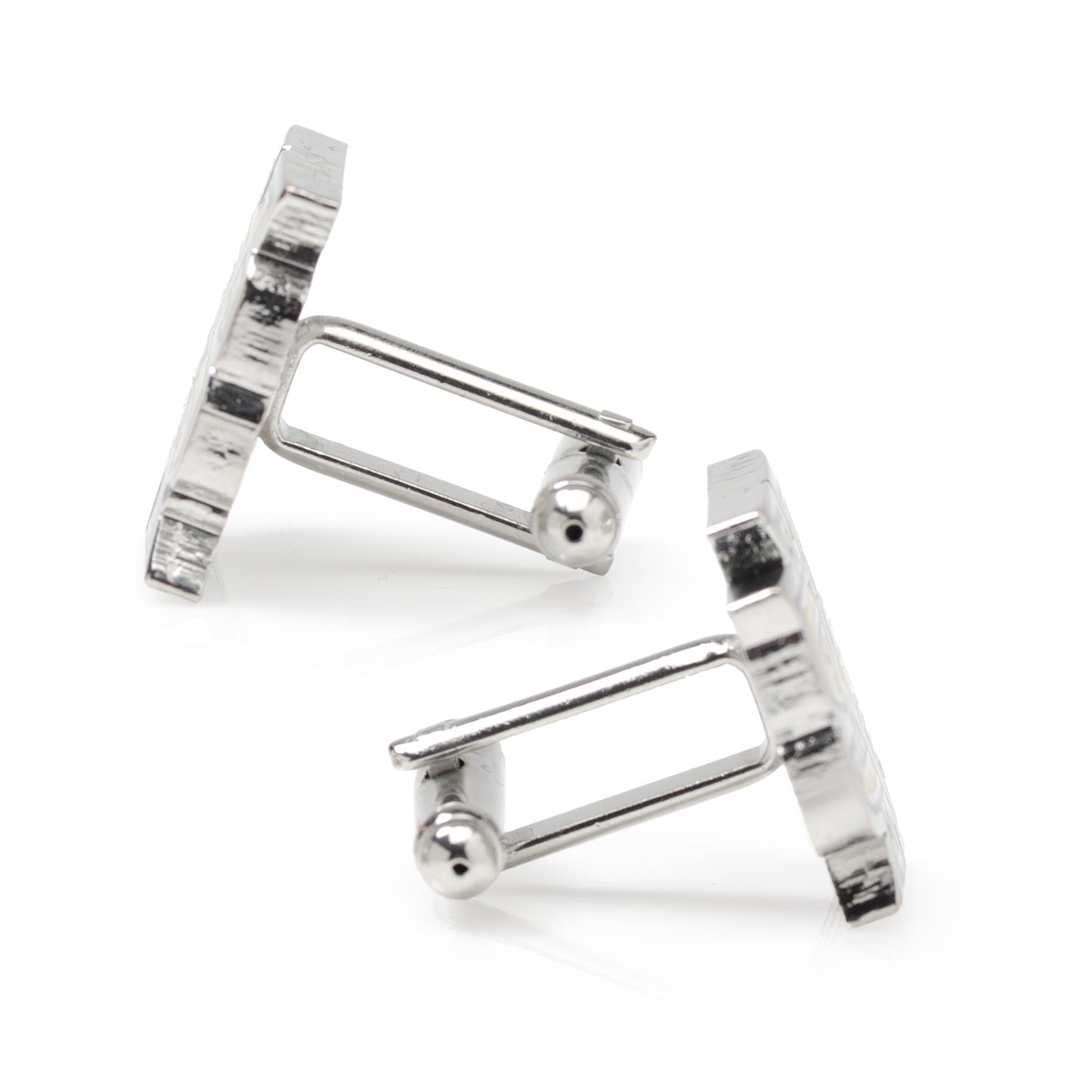 Silver cufflinks on a white background