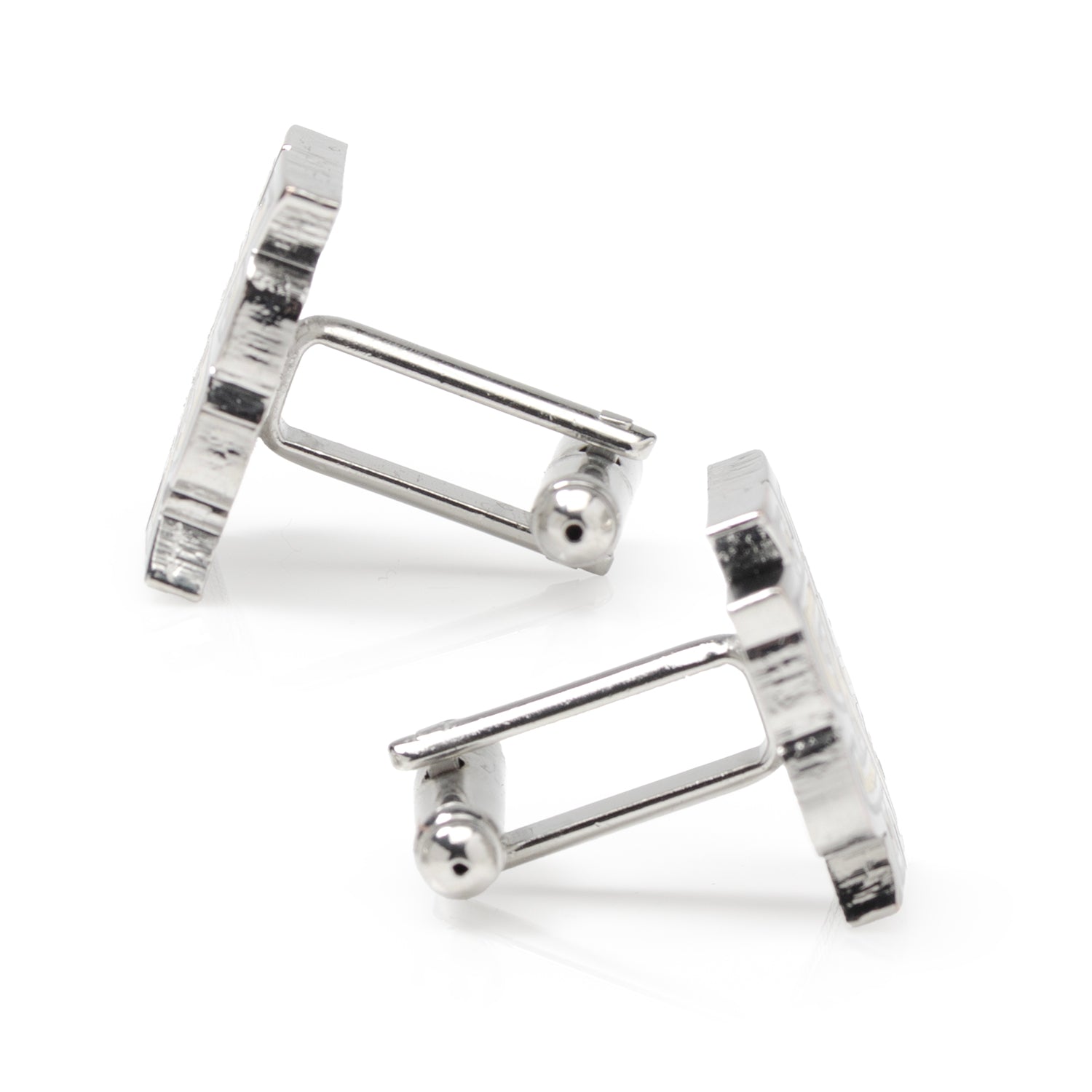 Silver cufflinks on a white background