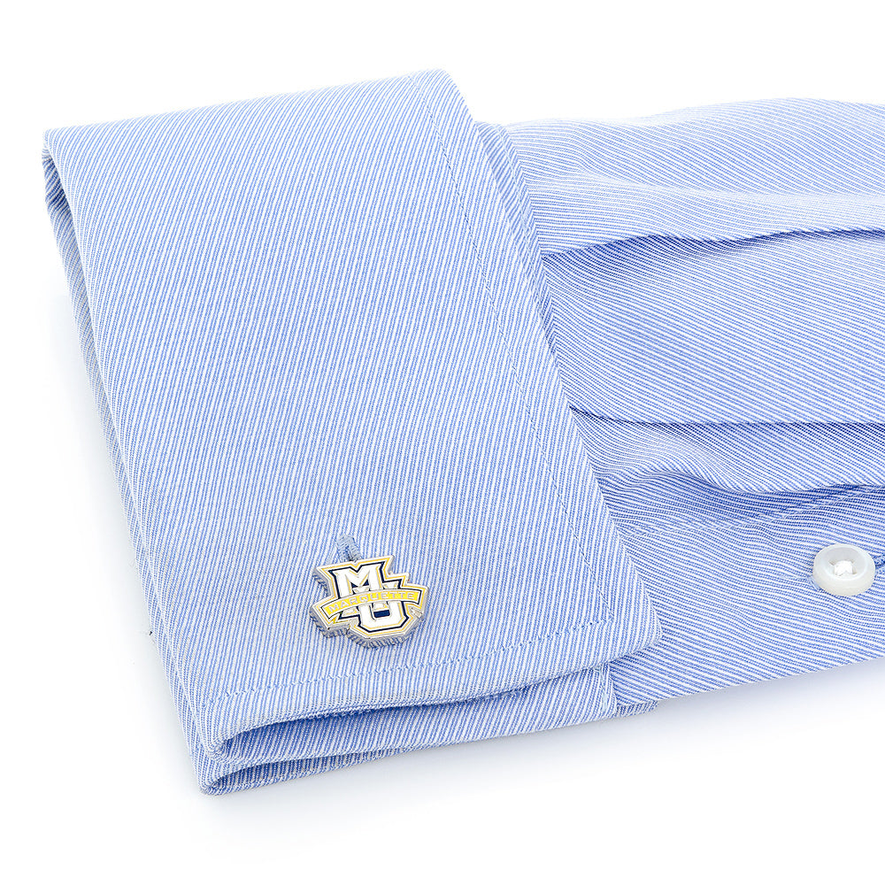 Marquette Golden Eagle Cufflinks Folded light blue striped shirt with cufflinks on a white background