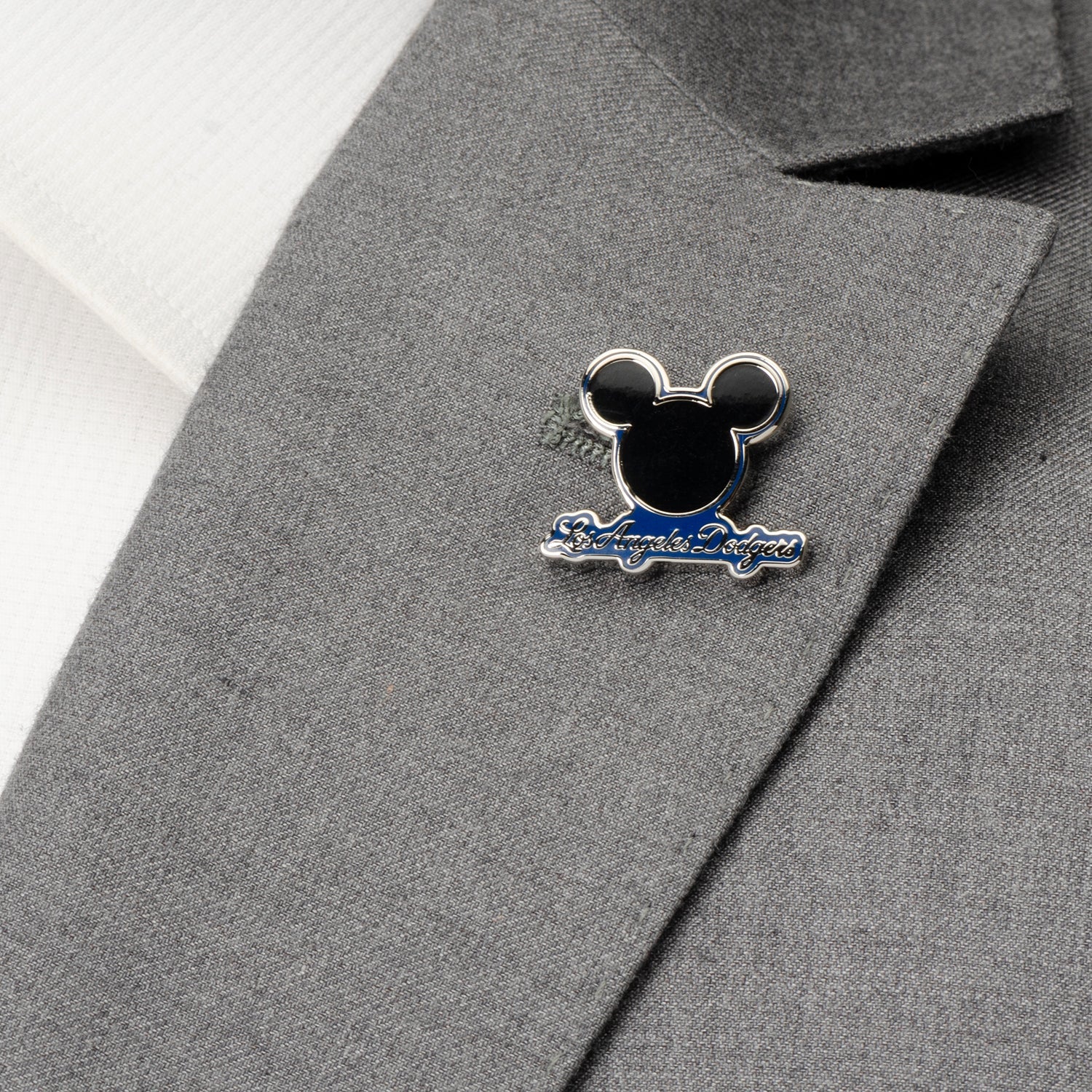 Pin with a design on a gray suit jacket