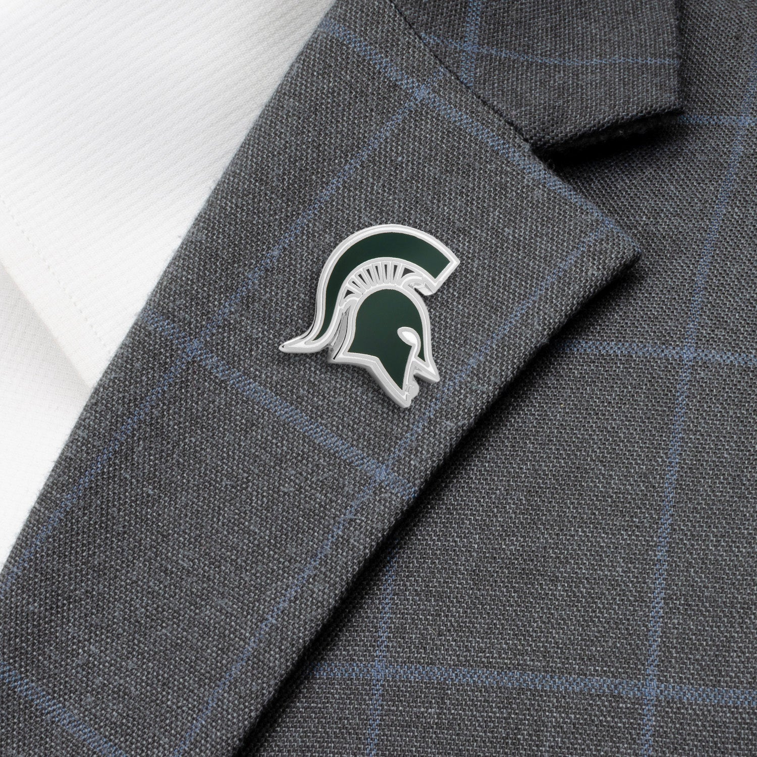 Gray suit jacket with a logo on the lapel