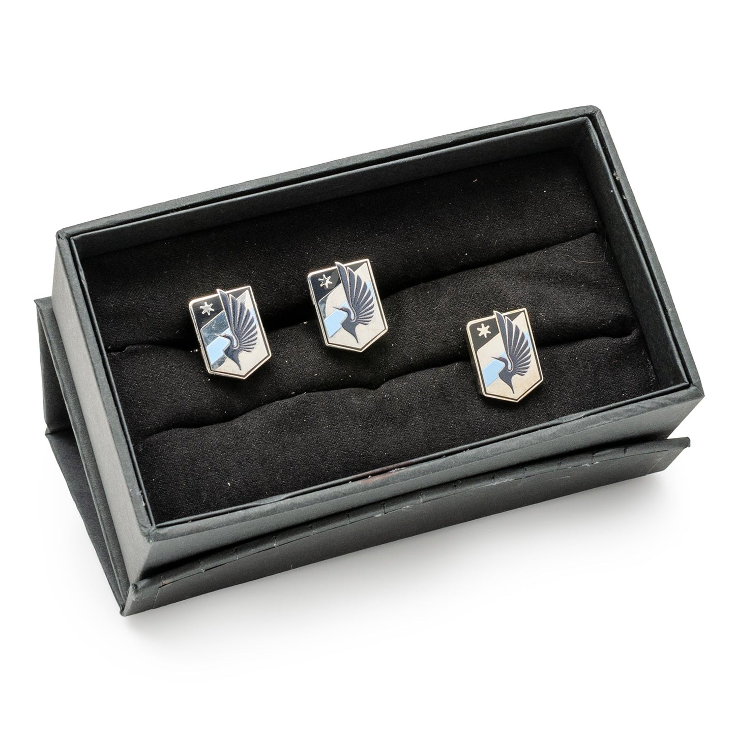 Set of three silver emblem-shaped cufflinks in a black box on a white background MLS Minnesota United Cufflinks and Lapel Pin