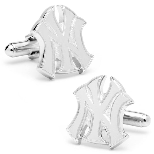 Silver cufflinks with a geometric design on a white background