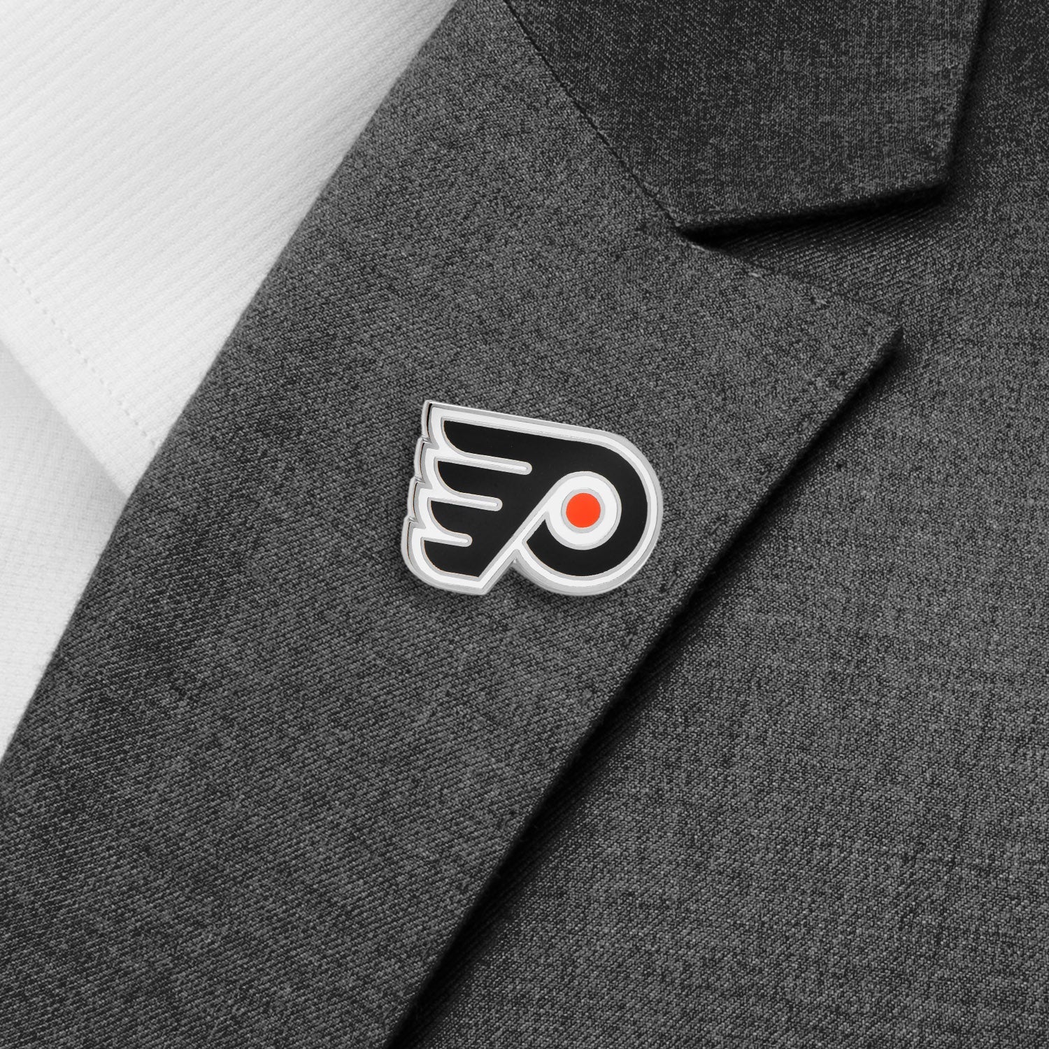 Embroidered logo on a gray jacket