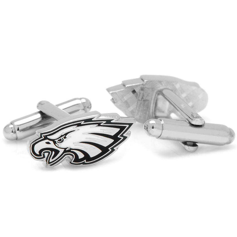Silver cufflinks with a black and white eagle logo on a white background