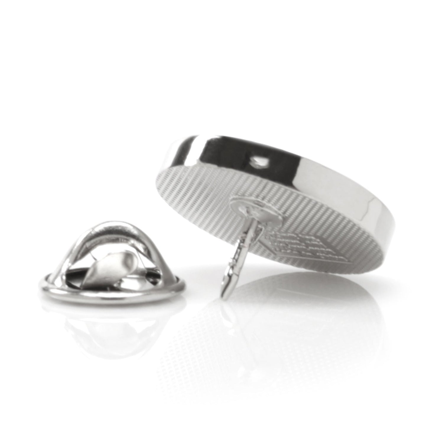 Two metallic pins on a white background