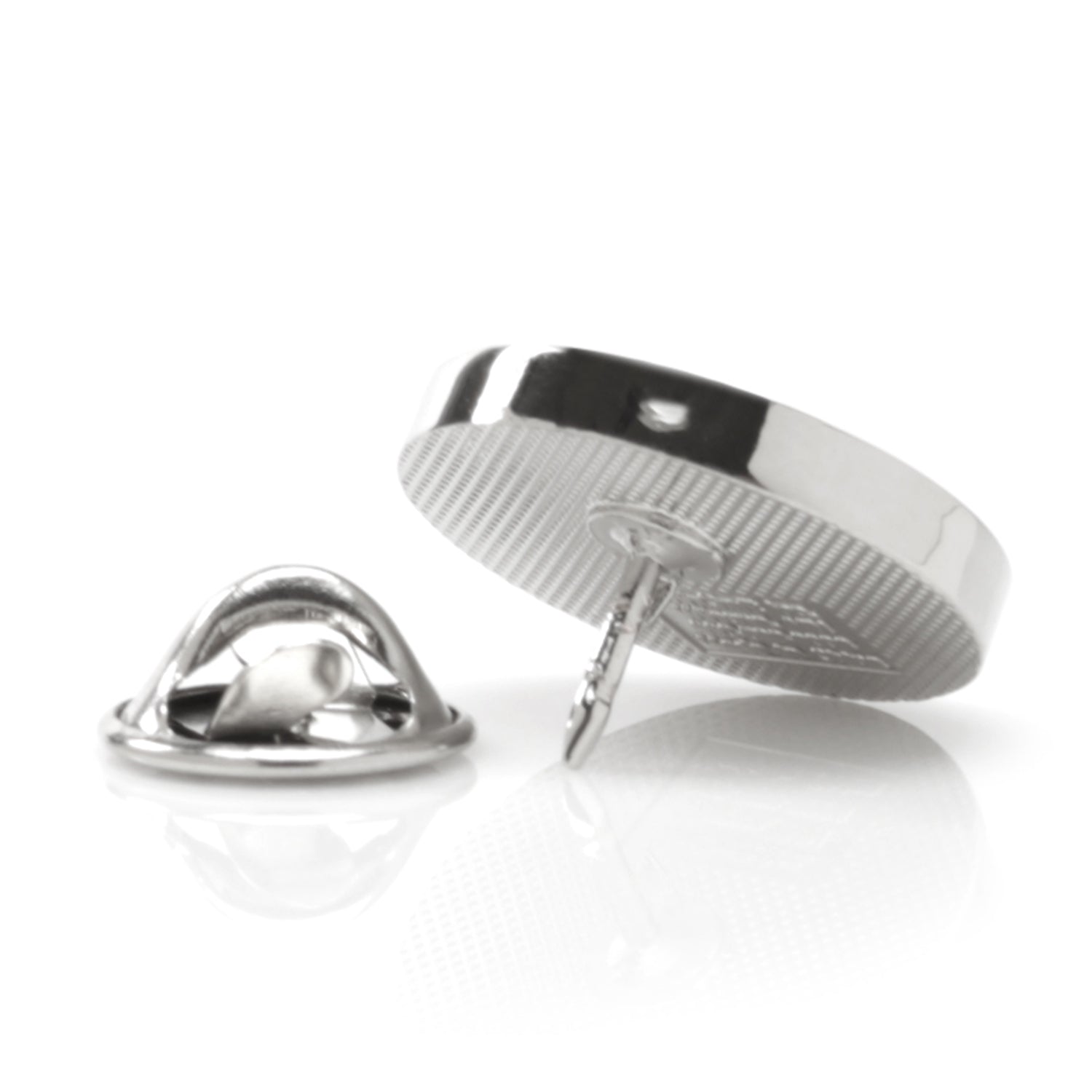 Two metallic pins on a white background
