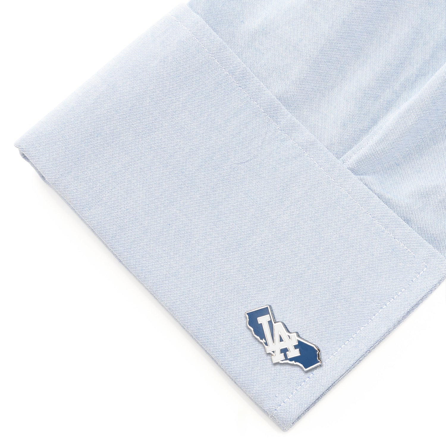 Light blue pocket square with a small logo on a white background