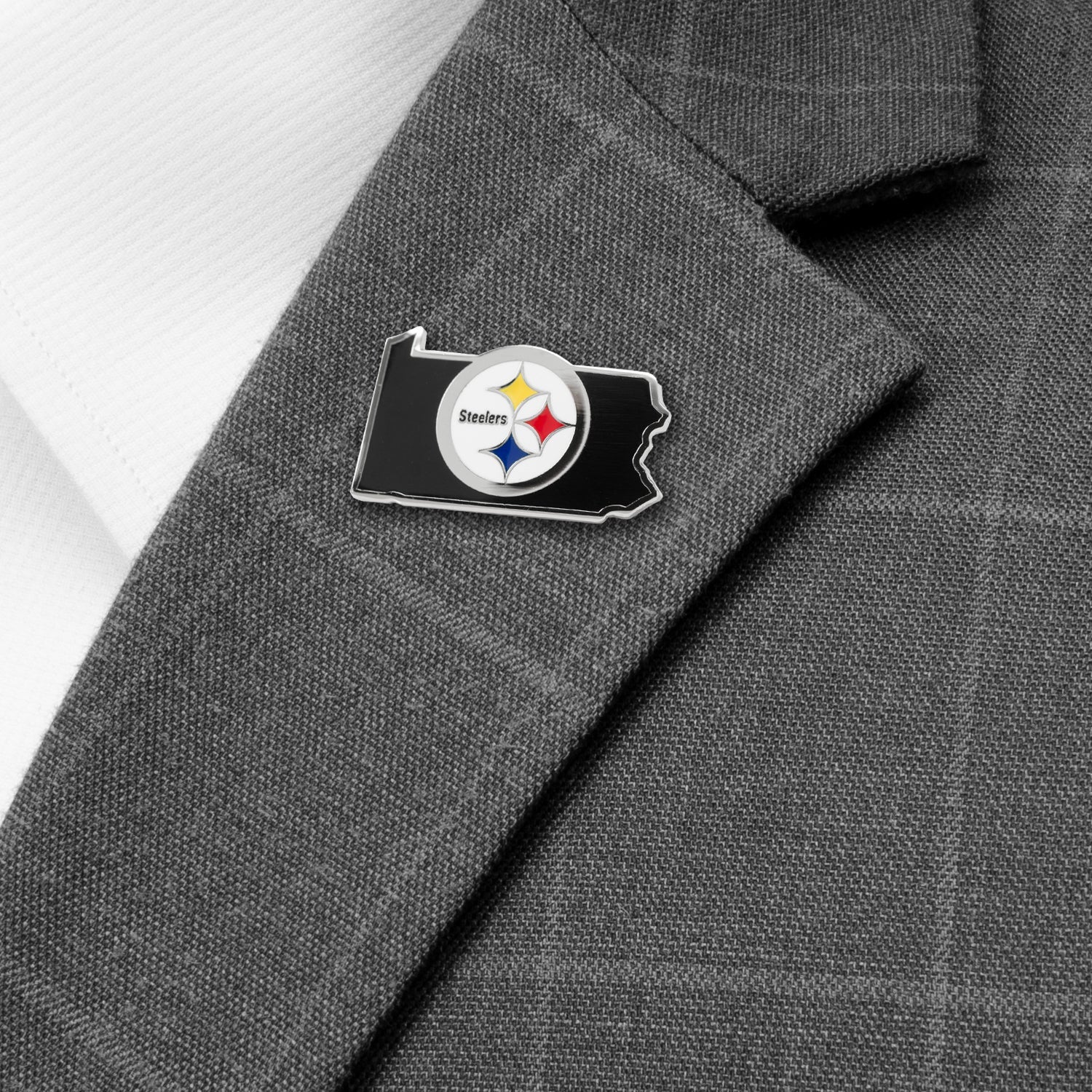 Pin with Steelers logo on a gray suit jacket