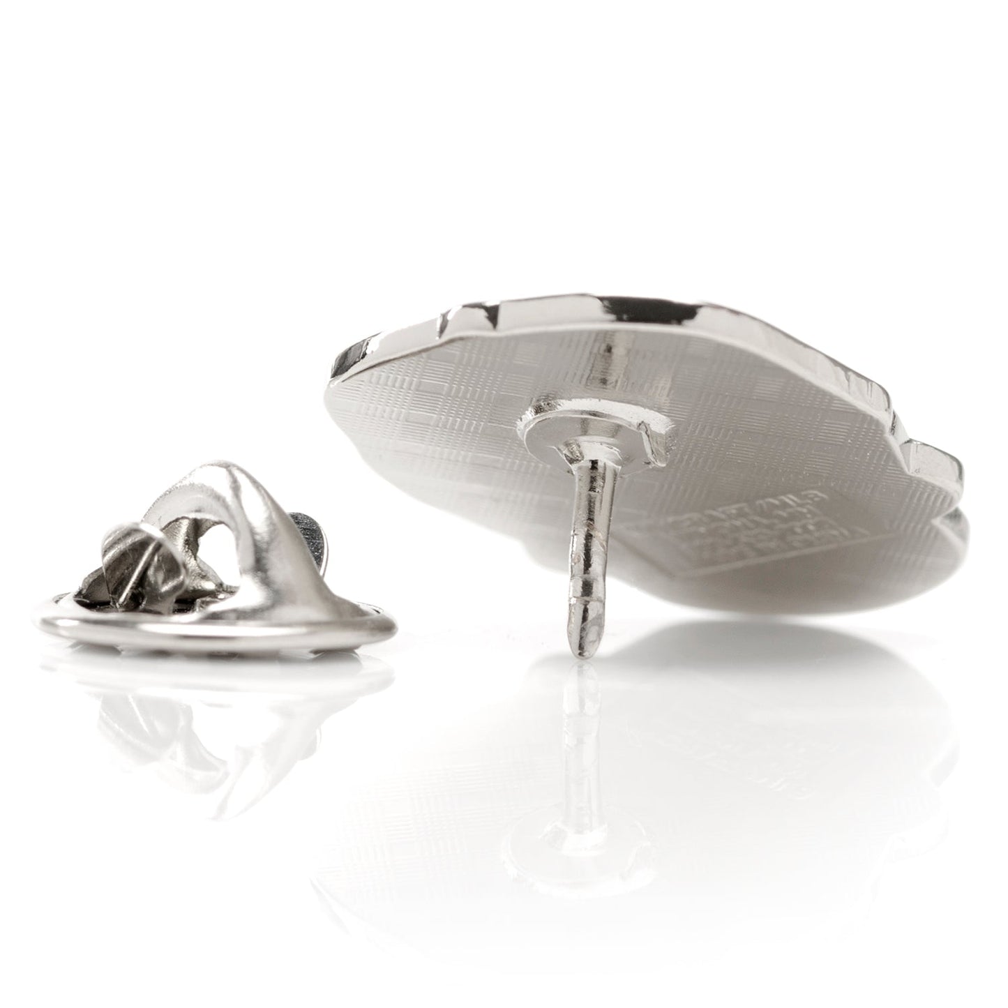Silver lapel pin on a white background