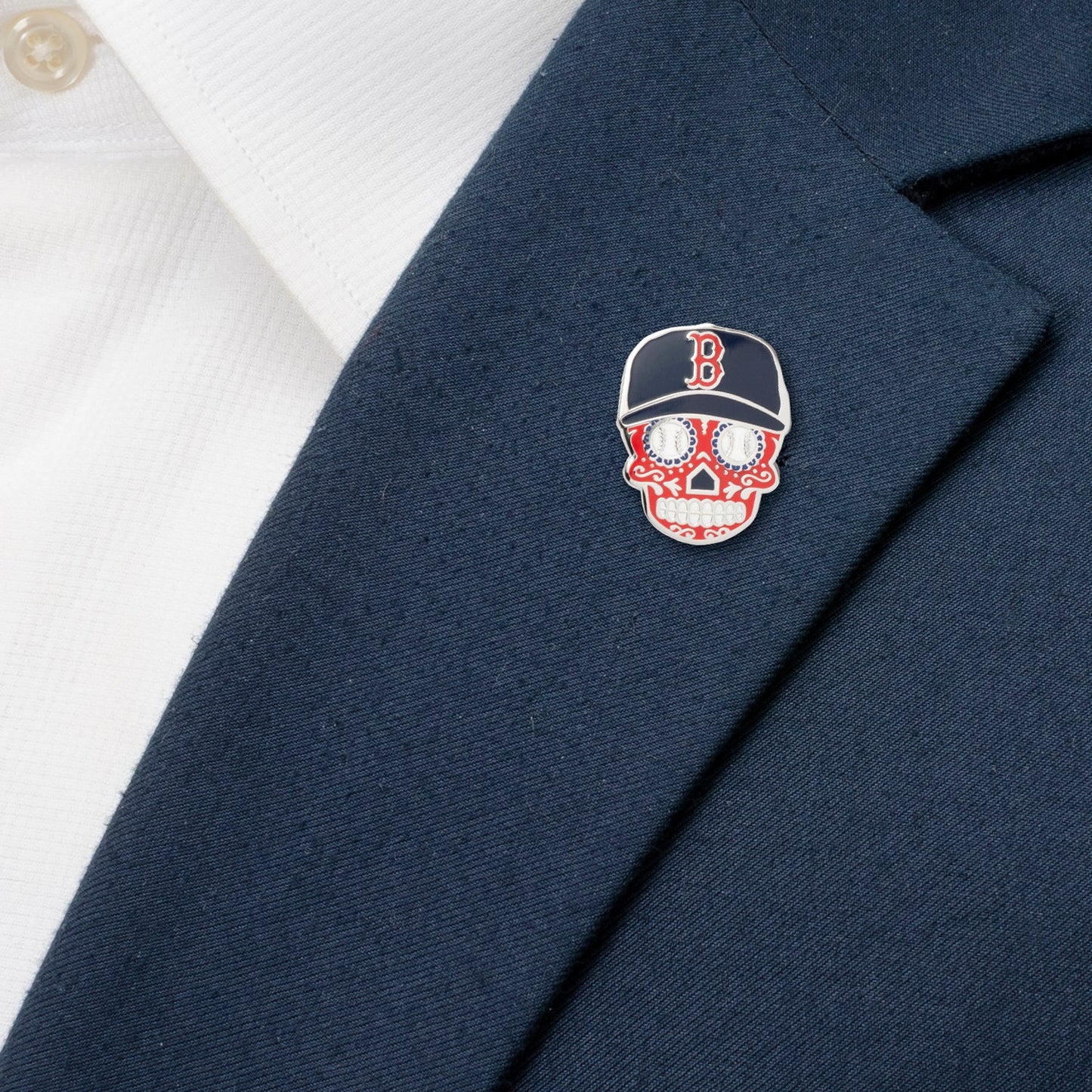 Navy blazer with a skull and baseball cap pin featuring the Boston Red Sox logo.