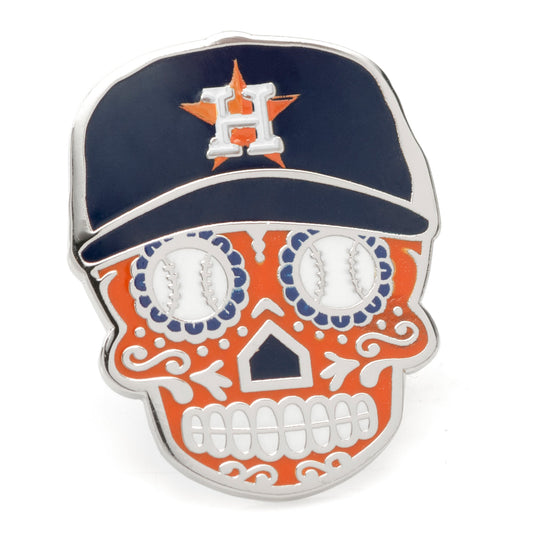 Skull-shaped pin with baseball design and Houston Astros cap on a white background
