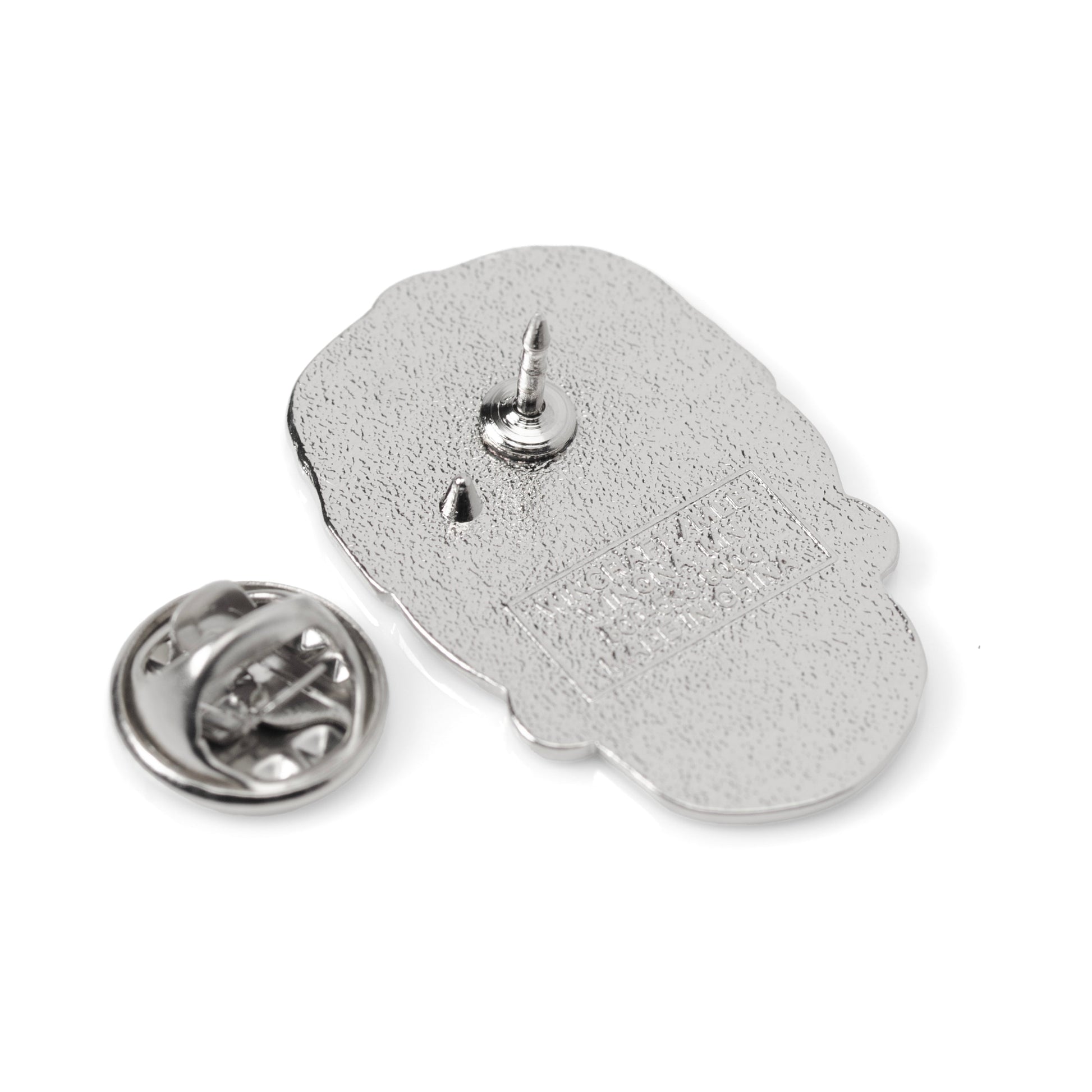 Silver Hamsa hand pin on a white background