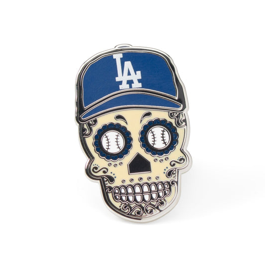 Skull-shaped pin with a blue cap featuring a logo on a white background