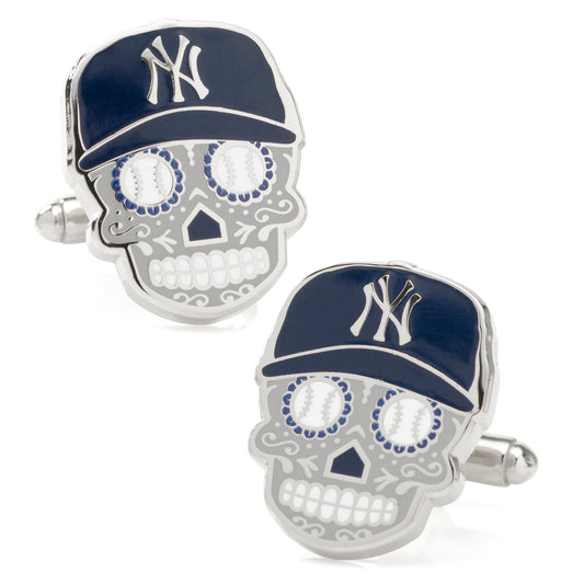 Skull-shaped cufflinks with New York Yankees logo on a white background