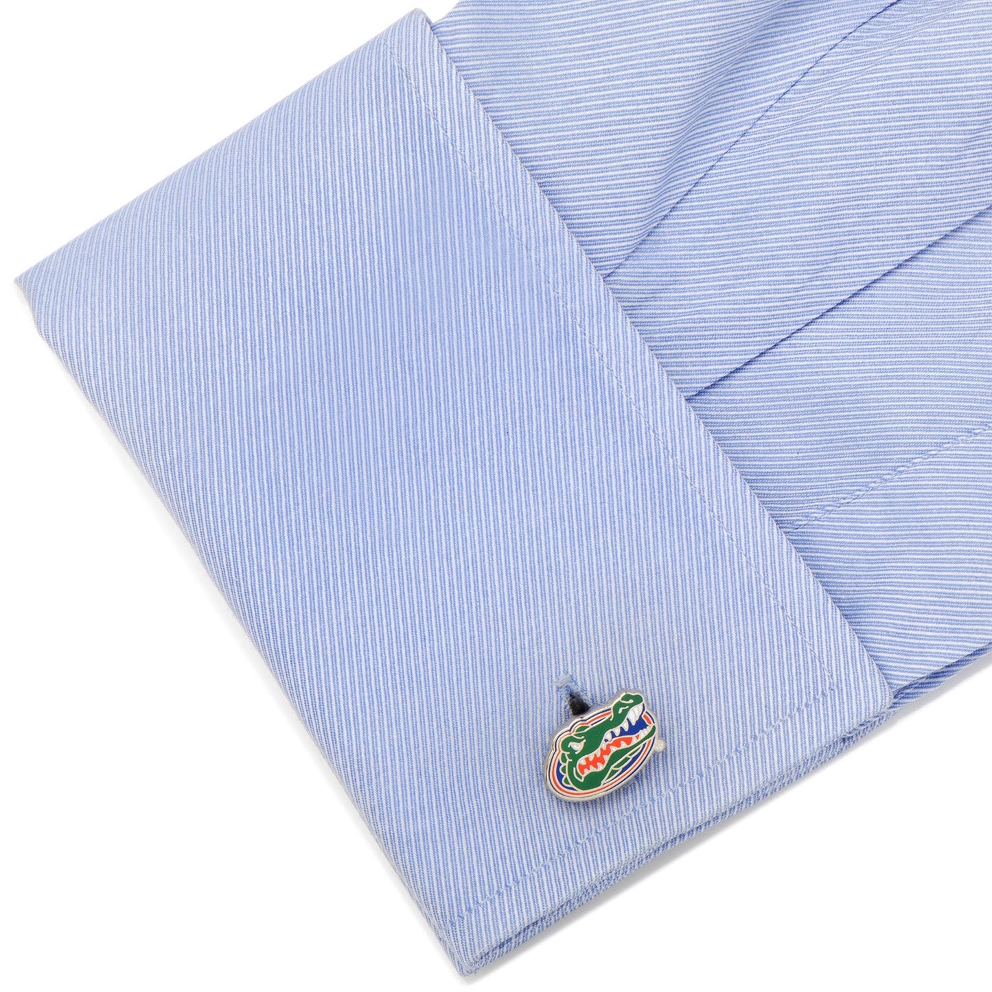 Cufflink with a gator design on a light blue striped shirt NCAA University of Florida Gators Cufflinks
