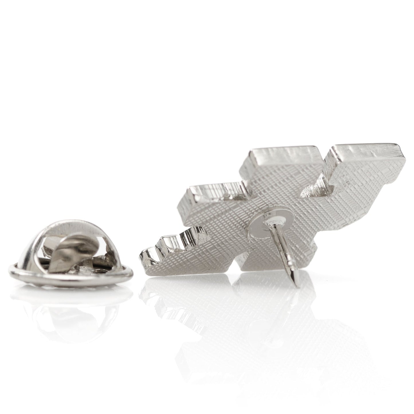 Silver tie pin with a geometric design on a white background