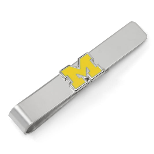 Silver tie clip with yellow 'M' on a white background