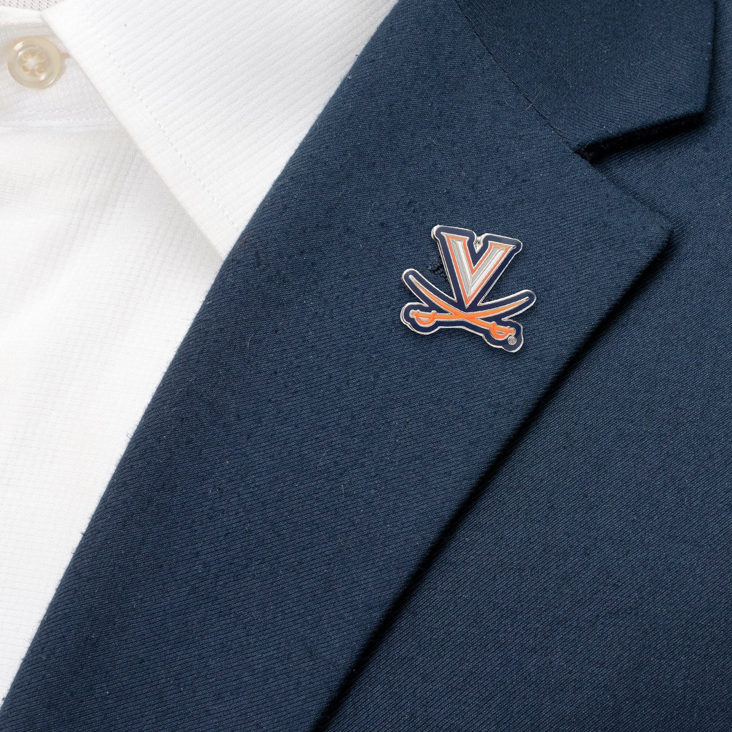 Navy blazer with a logo on the chest against a white background