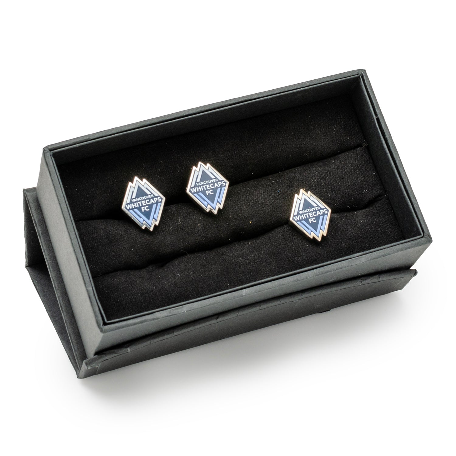 Set of three blue and silver cufflinks in a black display box on a white background