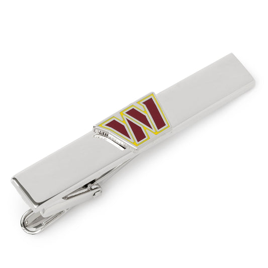 Silver tie clip with red 'W' on a white background