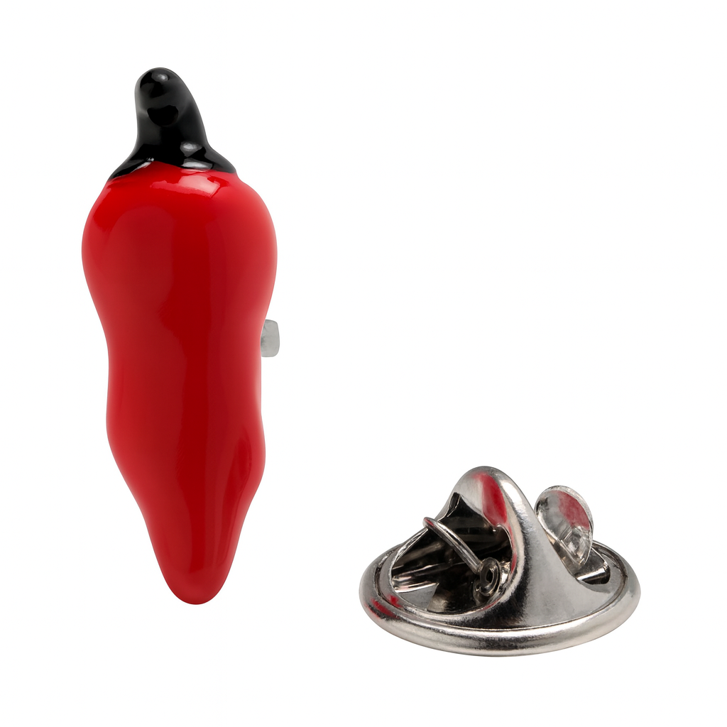 Red pepper-shaped lapel pin with a black top on a white background